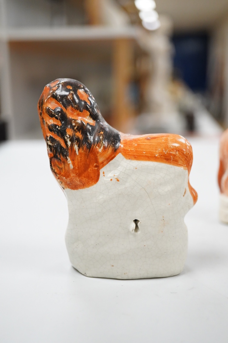 A rare Staffordshire Pearlware model of a recumbent lion, c.1810, and three Staffordshire pottery models of lions, mid 19th century, largest 11cm wide